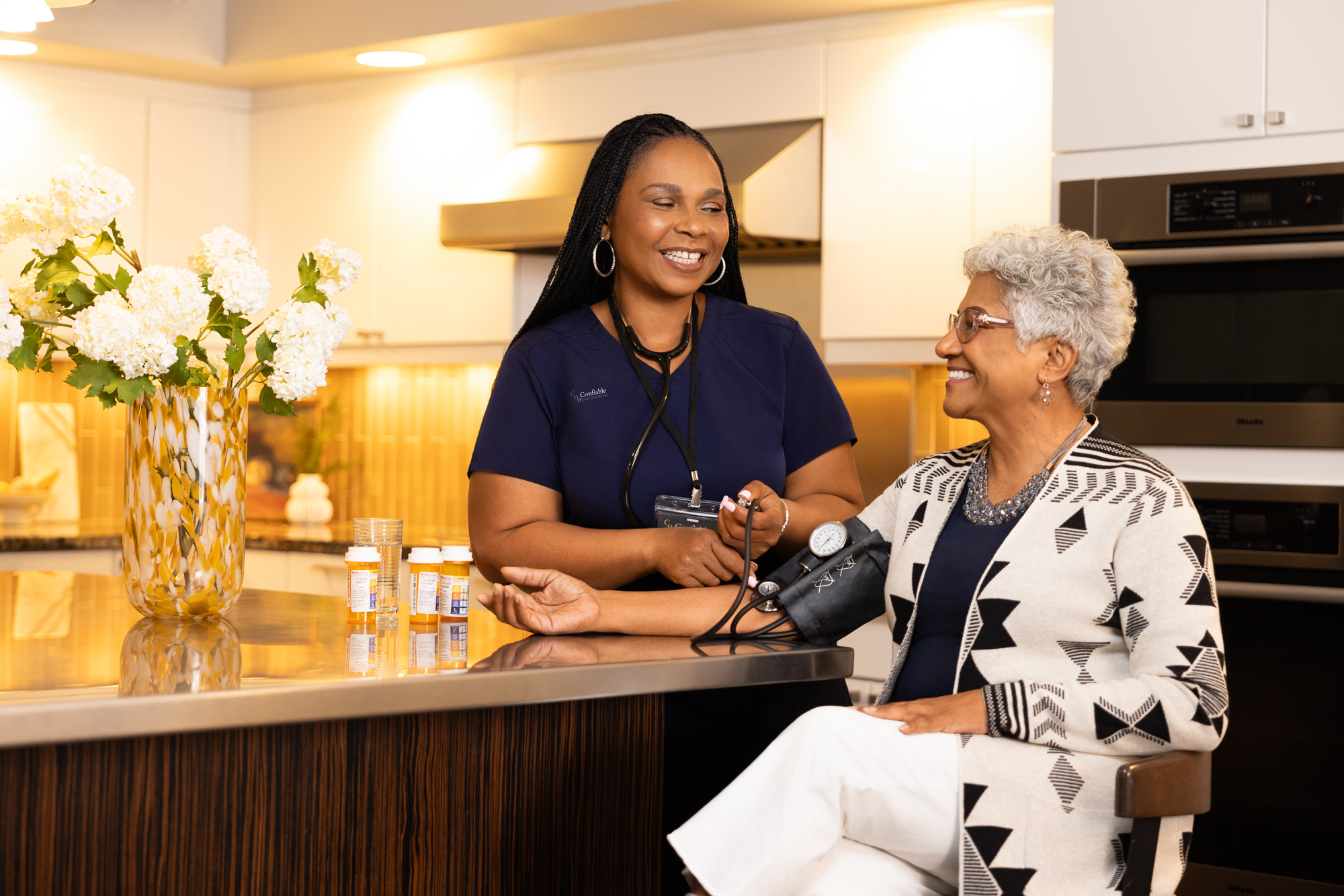 Caregiver providing private-pay post-hospital home care services by monitoring a senior's health during recovery in Pittsburgh